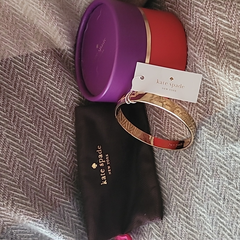 This is the year idiom kate spade bangle..New with tags, box and bag
